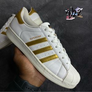 Adidas superstar list gold clearance